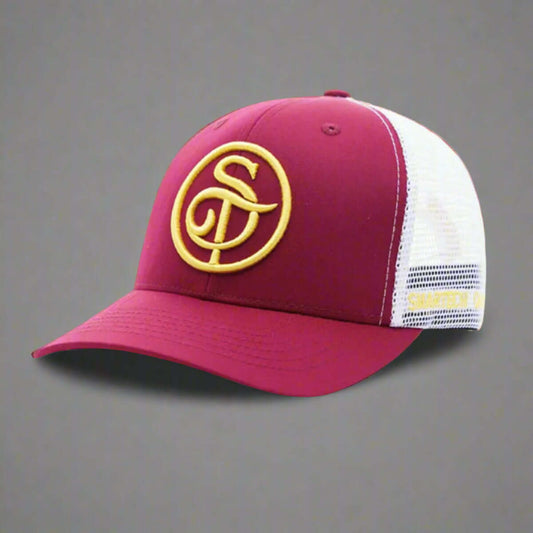 The Smartech Outfit Burgundy Trucker Mesh Cap is a premium cap featuring a burgundy and white design with a yellow embroidered logo of intertwined letters on the front. It offers a mesh back for ventilation, an adjustable snapback closure, and UV light protection for extra durability.